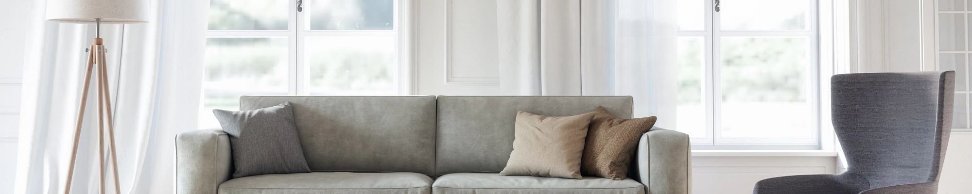 Couch and armchair in bright living room - Essex Paint and Carpet in the Essex Junction, VT area